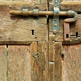 Door bolt detail, Tuscany, Italy by Neale And Judith Clark