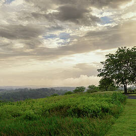 Dramatic Skies Over A Serene Landscape by Jason Fink