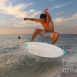 Dynamic Skimboarding at Sunset by Donn Ingemie