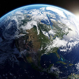 Earth from Space with Sunlight by The Luxury Art Collection