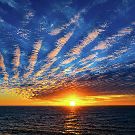 Fan Clouds at Sunset by Tommy Farnsworth