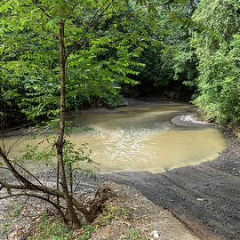 Fording the river on the Monkey Trail by Joe Schofield