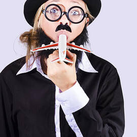 Funny woman eating toy plane by Jorgo Photography