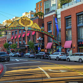 Gaslamp Quarter sign in San Diego, California, with bustling street scene by Miroslav Liska