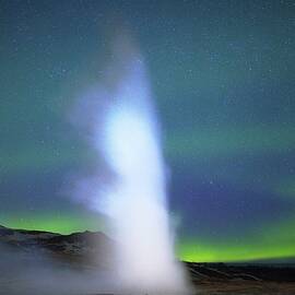 Geyser and aurora by Christopher Mathews