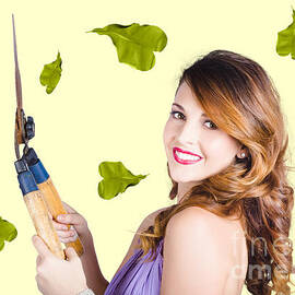 Glamorous woman gardening by Jorgo Photography