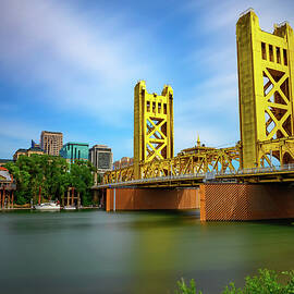 Gold Tower Bridge and Sacramento River in Sacramento, California by Miroslav Liska