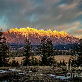Golden Hour on Snow-Capped Mountains by Thomas Nay