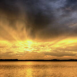 Golden Storm Sunset Over Trout Lake by Dale Kauzlaric