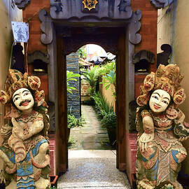 Guardian Statues at Garden Entrance by Travel Essayist