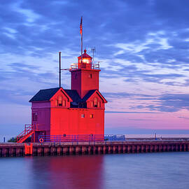 Holland Harbor Lighthouse at Sunset by Michael Collins