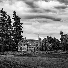Homestead Beneath the Storm  Black and White Farmhouse Landscape by Kevin Schwalbe