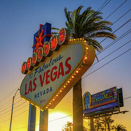 Iconic Welcome to Fabulous Las Vegas Nevada sign with palm trees by Miroslav Liska