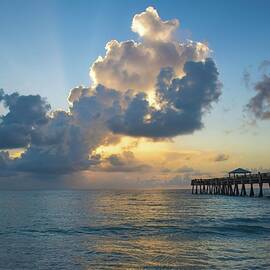 Juno Beach Pier Sunrise with Towering Clouds by Rebecca Herranen