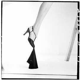 Leg Of A Model Wearing a T-Strap Sandal by Richard Rutledge