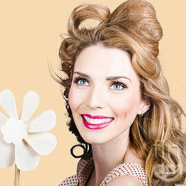 Light brunette pin-up girl with toy wind turbine by Jorgo Photography