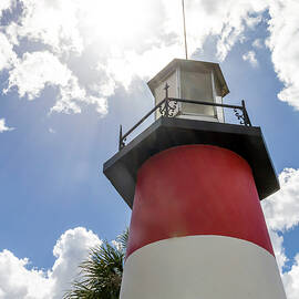 Lighthouse Against a Bright Sky in Gilbert Park, Mount Dora, FL by John Twynam