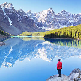 Lone hiker at Moraine Lake, Canadian Rockies by Neale And Judith Clark