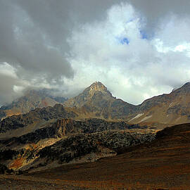 Majestic Teton Mountain Range Under Cloudy Skies at Hurricane Pass by Raymond Salani III