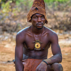 Member of the african tribe Himba traditionally dressed in Opuwo, Namibia by Miroslav Liska