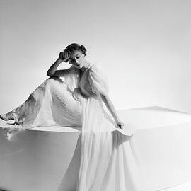 Model on Platform in Pleated Gown by Cecil Beaton