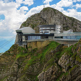 Mount Pilatus in Switzerland with a cable car station and a mountain resort by Miroslav Liska