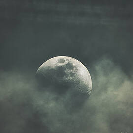 Mysterious Moon Amidst Clouds by Rene Vasquez