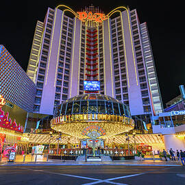 Night view of Plaza Hotel and Casino on Fremont Street in Las Vegas by Miroslav Liska