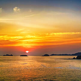 Orange sky in Ixtapa, Mexico by Tatiana Travelways