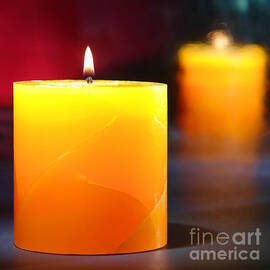 Pillar Candle Burning on Black by Olivier Le Queinec
