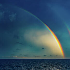 Rainbows at Sea Somewhere in the Caribbean by Tommy Farnsworth