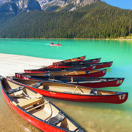 Red Canoes on Lake Louise, Banff national Park, Alberta, Canada by Neale And Judith Clark
