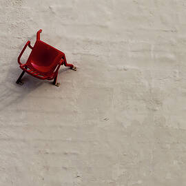 Red Chair on Wall by Chad Thunberg
