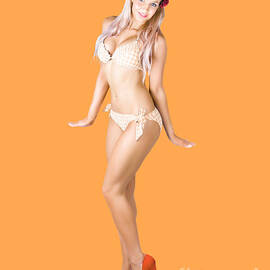 Retro beach pinup in swimwear by Jorgo Photography