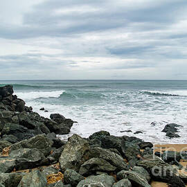 Rocky Shoreline and Serene Waves at Domes Beach in Rincon by Beachtown Views