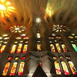 Sagrada Familia Church with Sunlit Stained Glass in Barcelona Spain by Travel Essayist