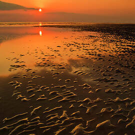 Sand patterns and Sunset on Tal y bont beach, Wales by Neale And Judith Clark