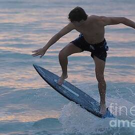 Skimboarder at Sunset 1984 by Donn Ingemie