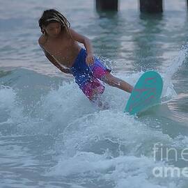Skimboarder in Action at Sunset 1980 by Donn Ingemie