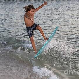 Skimboarding Trick at Sunset 7574 by Donn Ingemie