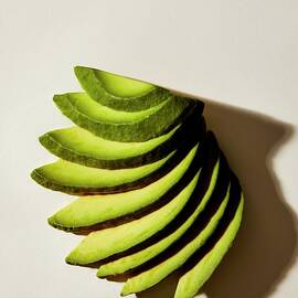 Sliced Avocados by Isabel Zapata
