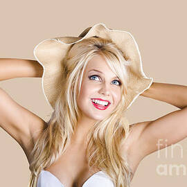 Smiling woman in floppy hat by Jorgo Photography