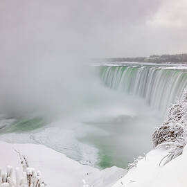 Snow-Covered Niagara Falls in Winter, Ontario, Canada by John Twynam