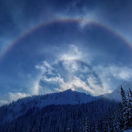 Solar Halo Over a Winter Mountain