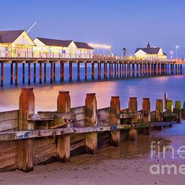 Southwold pier at night, Suffolk, England by Neale And Judith Clark