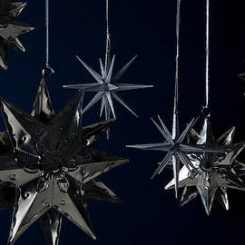Still Life of Silver Star Ornaments by Romulo Yanes
