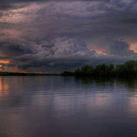 Storm Cloud And Golden Glow Over Lake Wausau by Dale Kauzlaric
