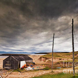 Stormy sky and abandoned fishing hut, Red point beach, Wester Ross, Scotland by Neale And Judith Clark