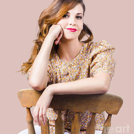 Stylish girl at rest on antique chair by Jorgo Photography
