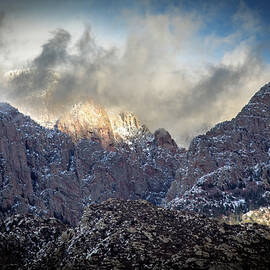 Sunlit Mountain Peaks in Winter by Howard Holley